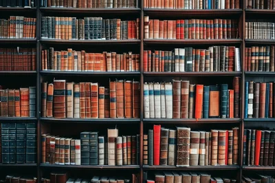Antique Leather Bound Books On Library Shelves
