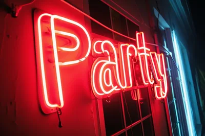 Bright Red Neon Party Sign On Building Exterior