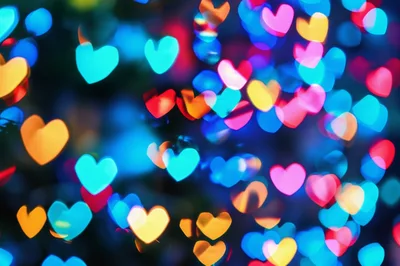 Abstract Background of Colorful Heart Shaped Bokeh Lights