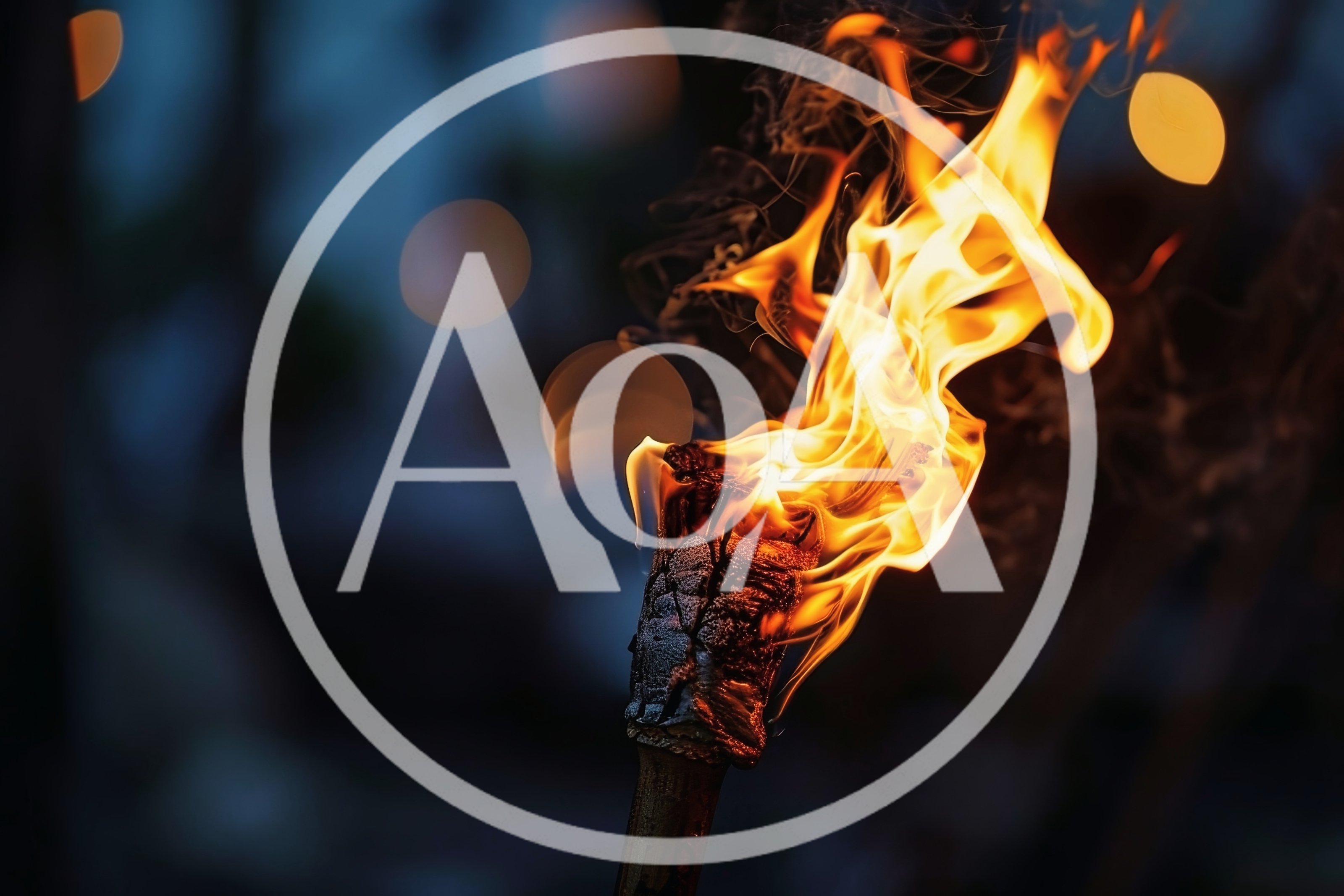 Burning Tiki Torch Against A Dark Blurred Background