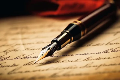 Fountain Pen Resting On Antique Handwritten Manuscript