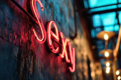 Neon Sexy Sign On A Textured Wall