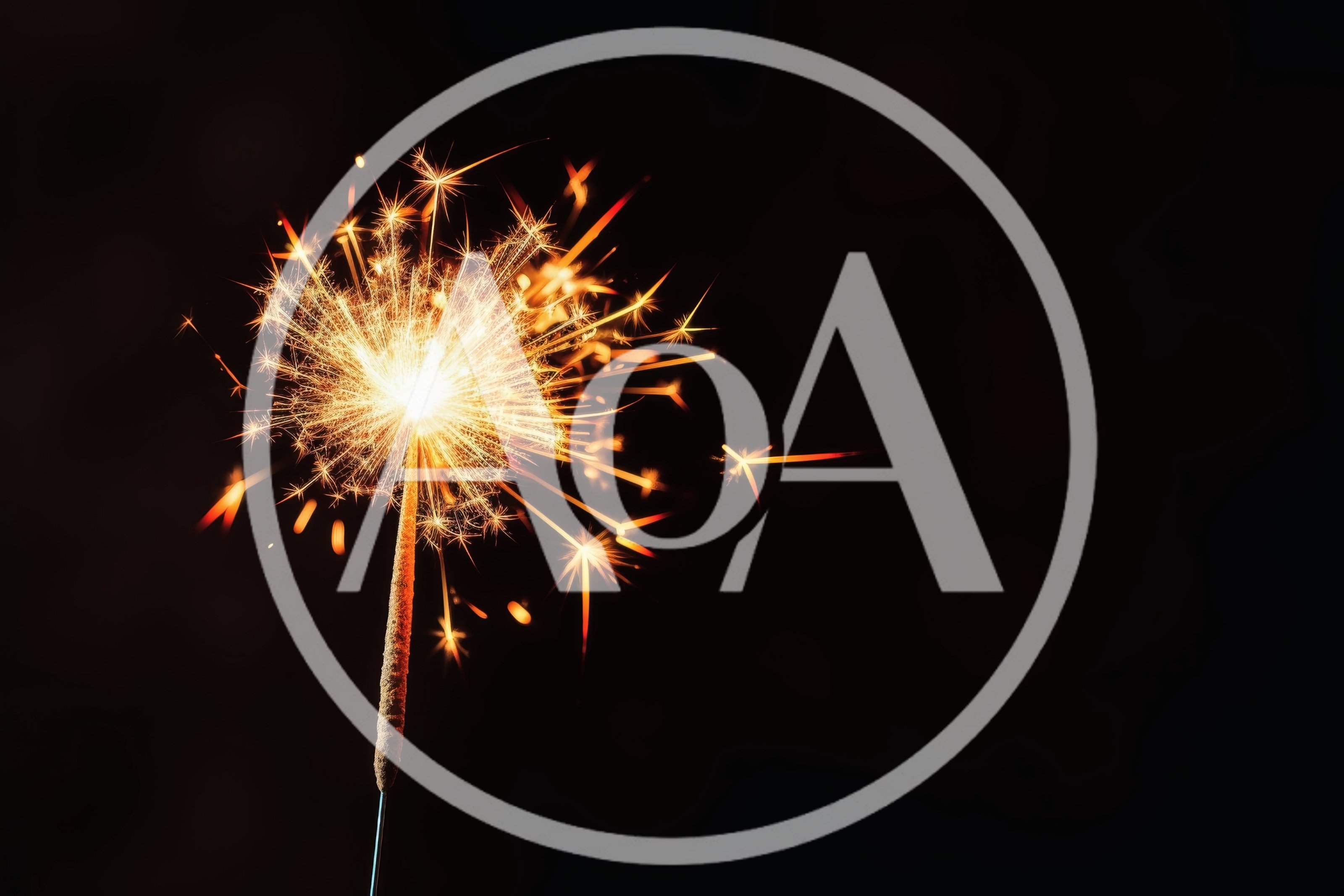 Bright Burning Sparkler Against Dark Background