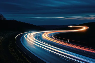Long Exposure Light Trails On A Winding Highway