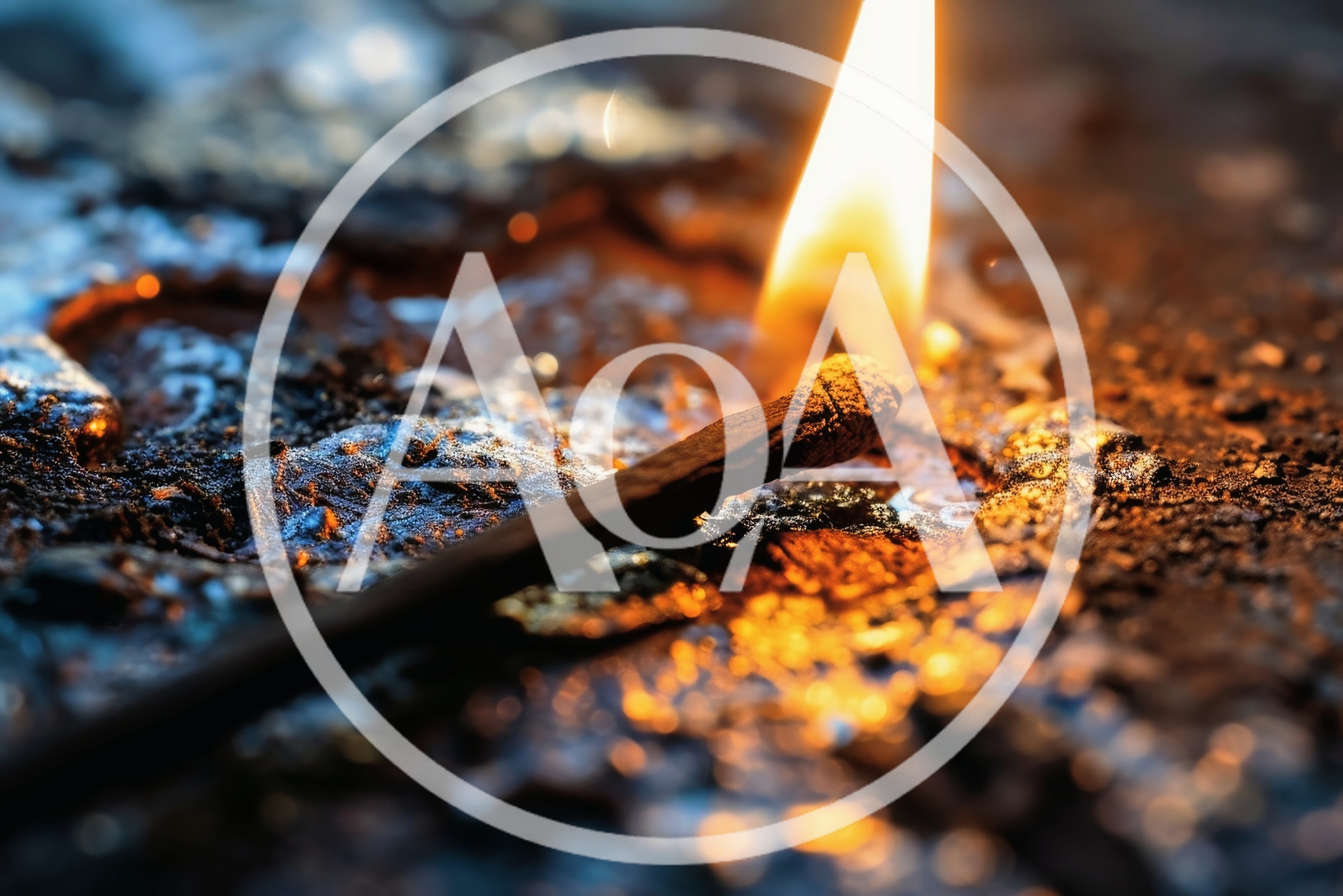 Burning Matchstick Resting On A Molten Metallic Surface