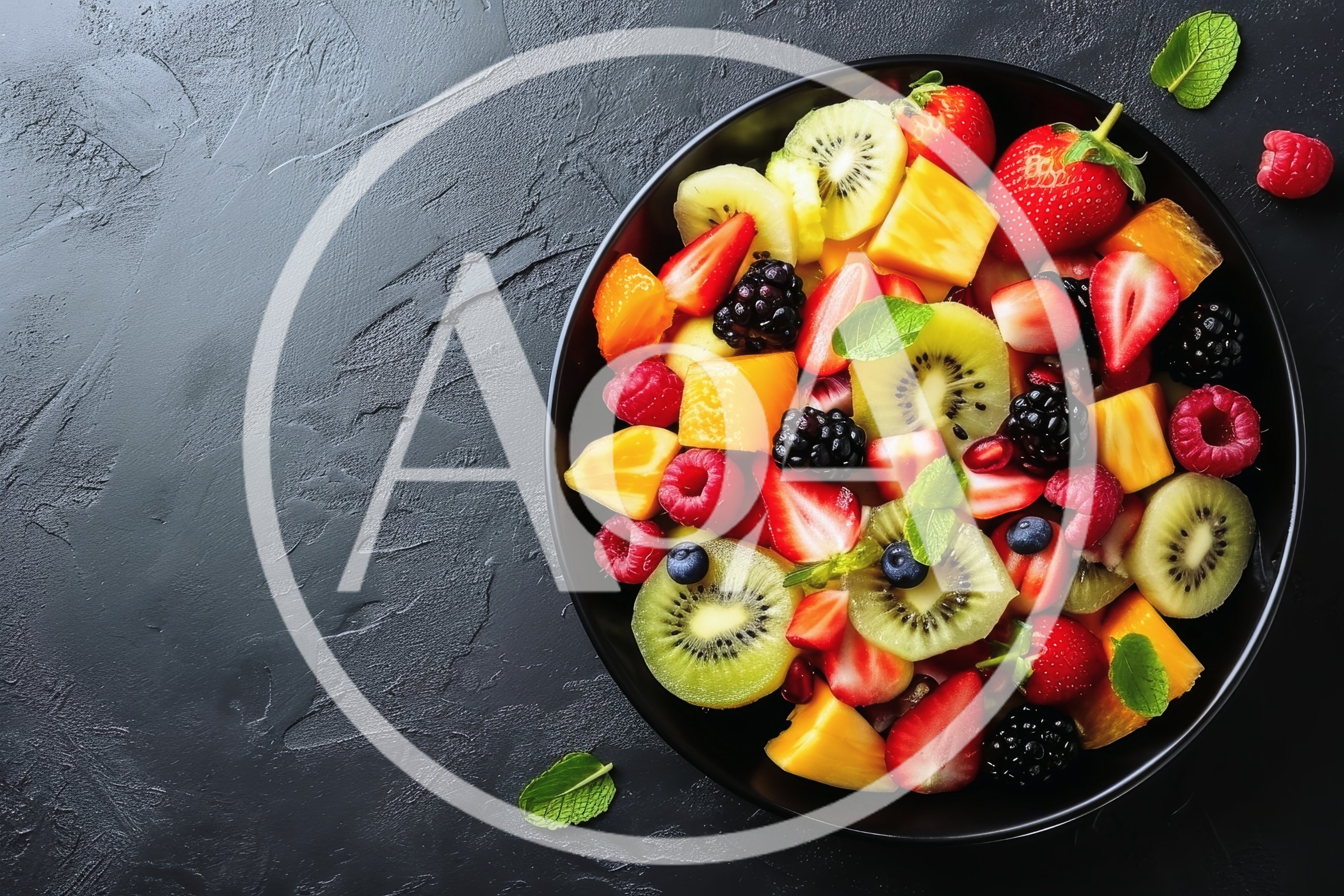 Fresh Fruit Salad in Black Bowl on Dark Surface