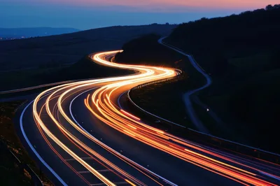 Long Exposure Light Trails On A Winding Highway