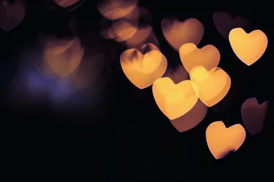 Golden Heart Shaped Bokeh Lights Background