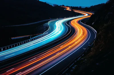 Long Exposure Light Trails On A Winding Highway