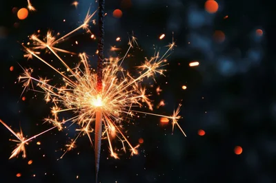 Burning Sparkler Emitting Bright Golden Sparks
