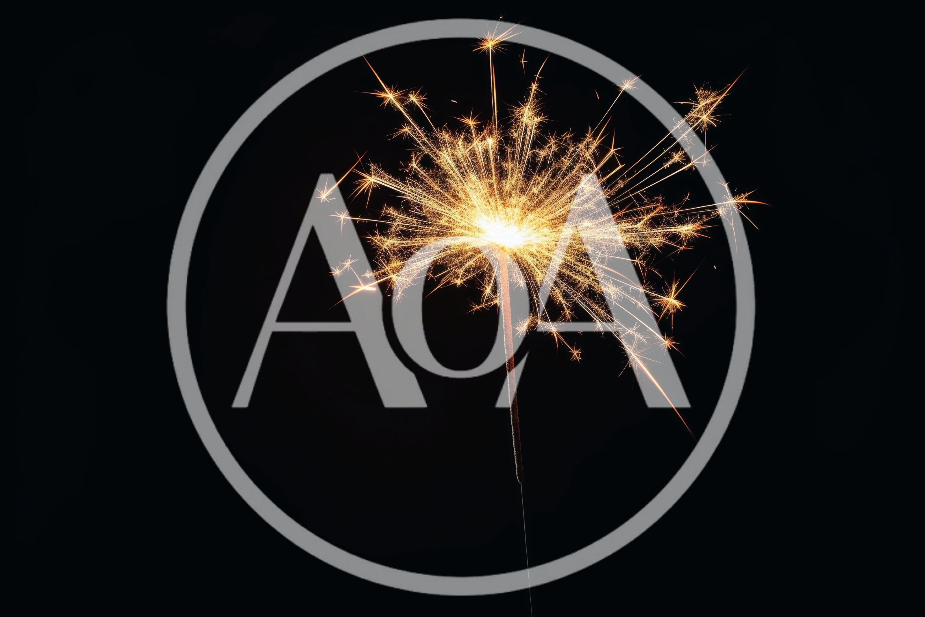 Bright Burning Sparkler Against A Dark Background