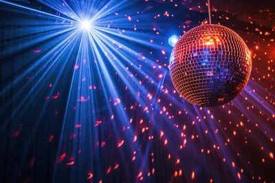 Disco Ball Reflecting Blue Light Beams In Nightclub