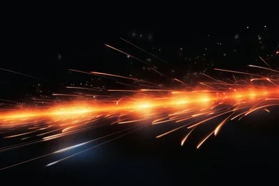 Bright Orange Sparks Flying Against A Dark Background