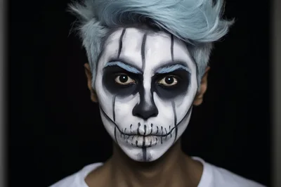 Person With Artistic Skull Face Paint And Blue Hair