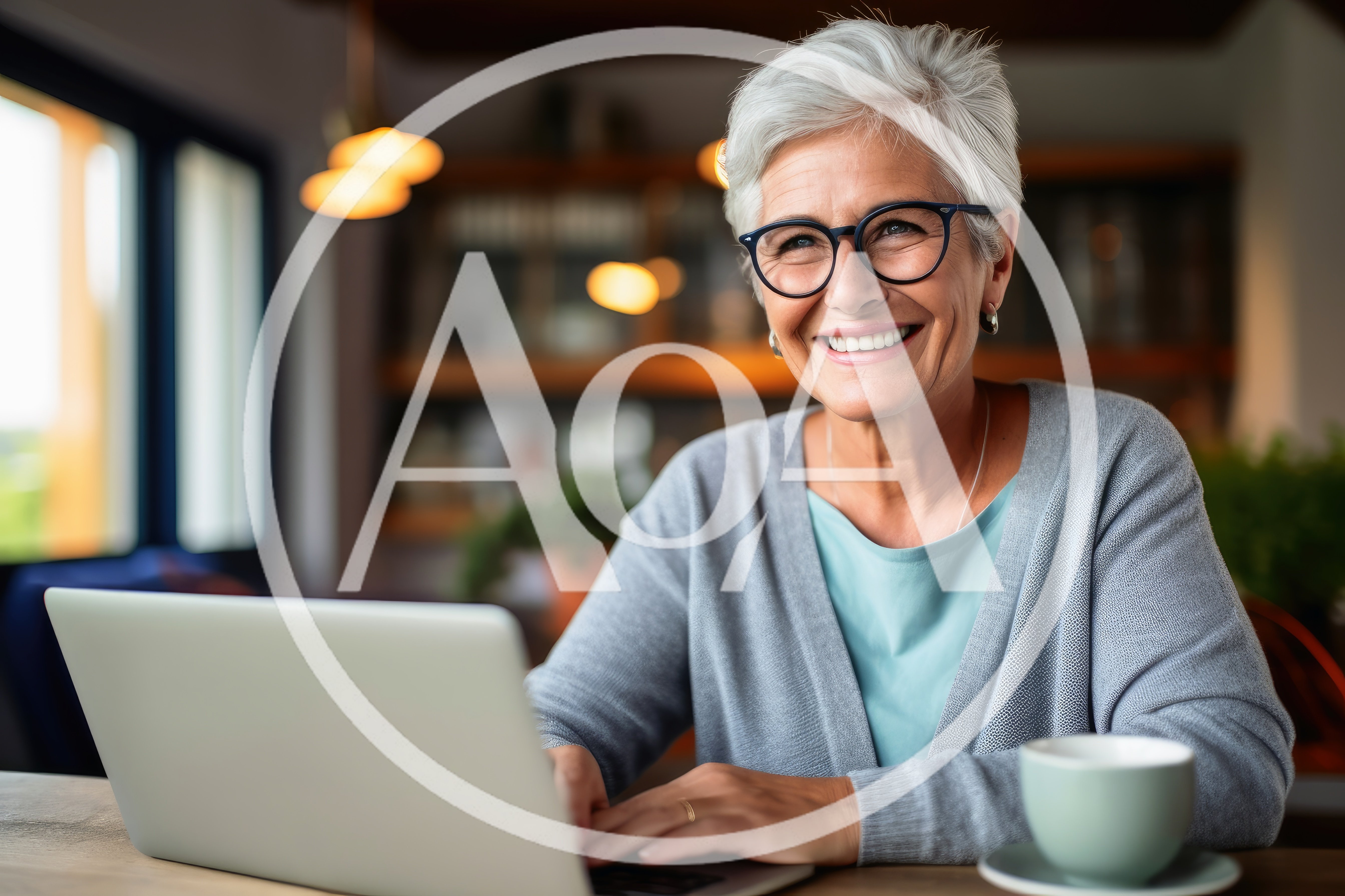 Senior Woman Working On Laptop In Cozy Cafe