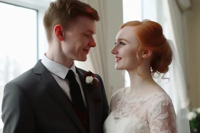 Happy Newlywed Couple Gazing Lovingly At Each Other
