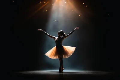 Ballerina Performing Graceful Dance Under Dramatic Spotlight