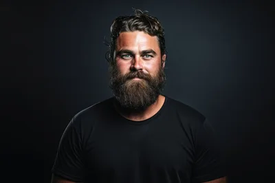 Portrait Of A Bearded Man Against Dark Background