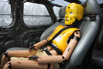 Crash Test Dummy Sitting In Vehicle Seat