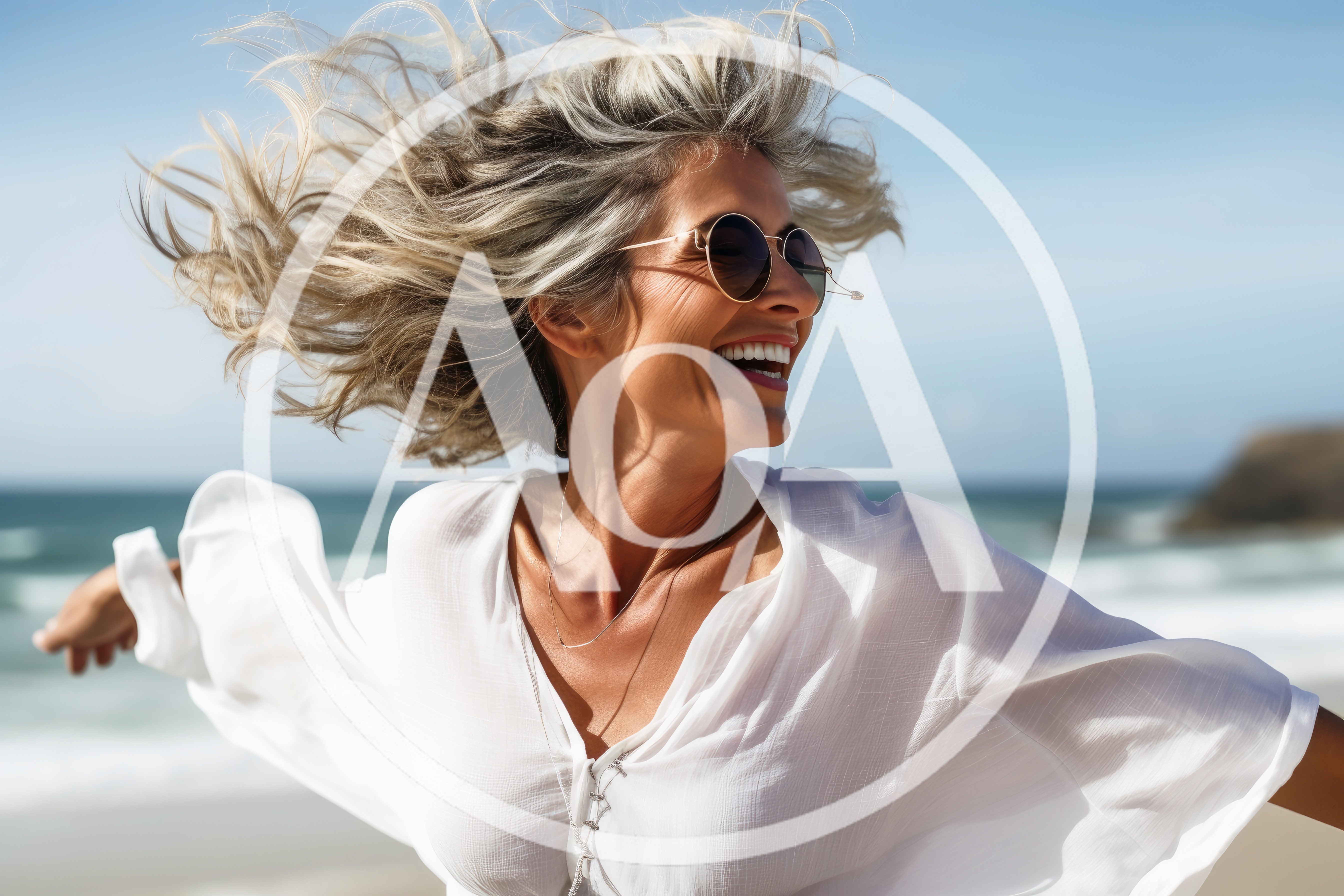 Happy Mature Woman With Flowing Hair On Beach