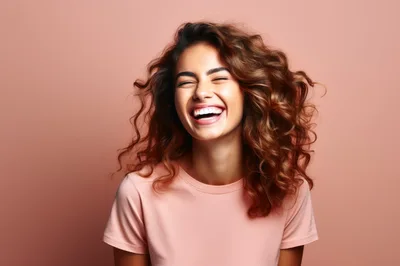 Happy Young Woman Laughing With Curly Hair