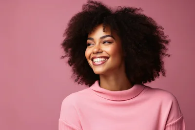 Portrait Of A Smiling Woman With Afro Hair