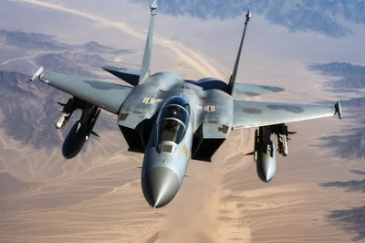 F-15 Eagle Fighter Jet Flying Over Desert Landscape
