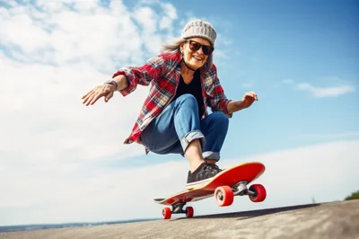 Active Senior Woman Skateboarding Outdoors