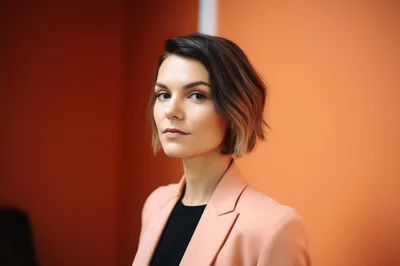 Professional Woman With Short Hair In Peach Blazer
