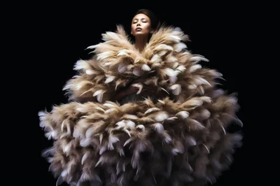 Fashion Model Wearing Voluminous Feather Couture Gown