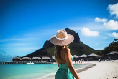 Woman In Sun Hat Walking On Tropical Beach