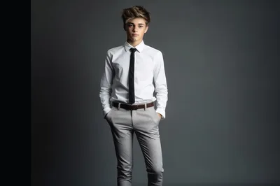 Stylish Teenage Boy Standing In Formal Attire