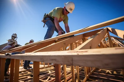 Construction Workers Framing Residential Roof Structure