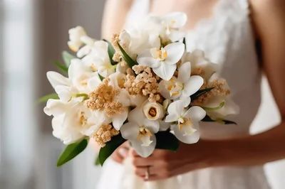 Bride Holding A White Floral Wedding Bouquet