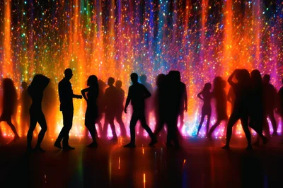 Silhouetted People Dancing At A Vibrant Nightclub Party