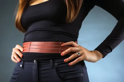 Woman Wearing A Stylish Brown Leather Belt