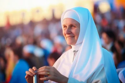 Smiling Nun Wearing Traditional White Habit