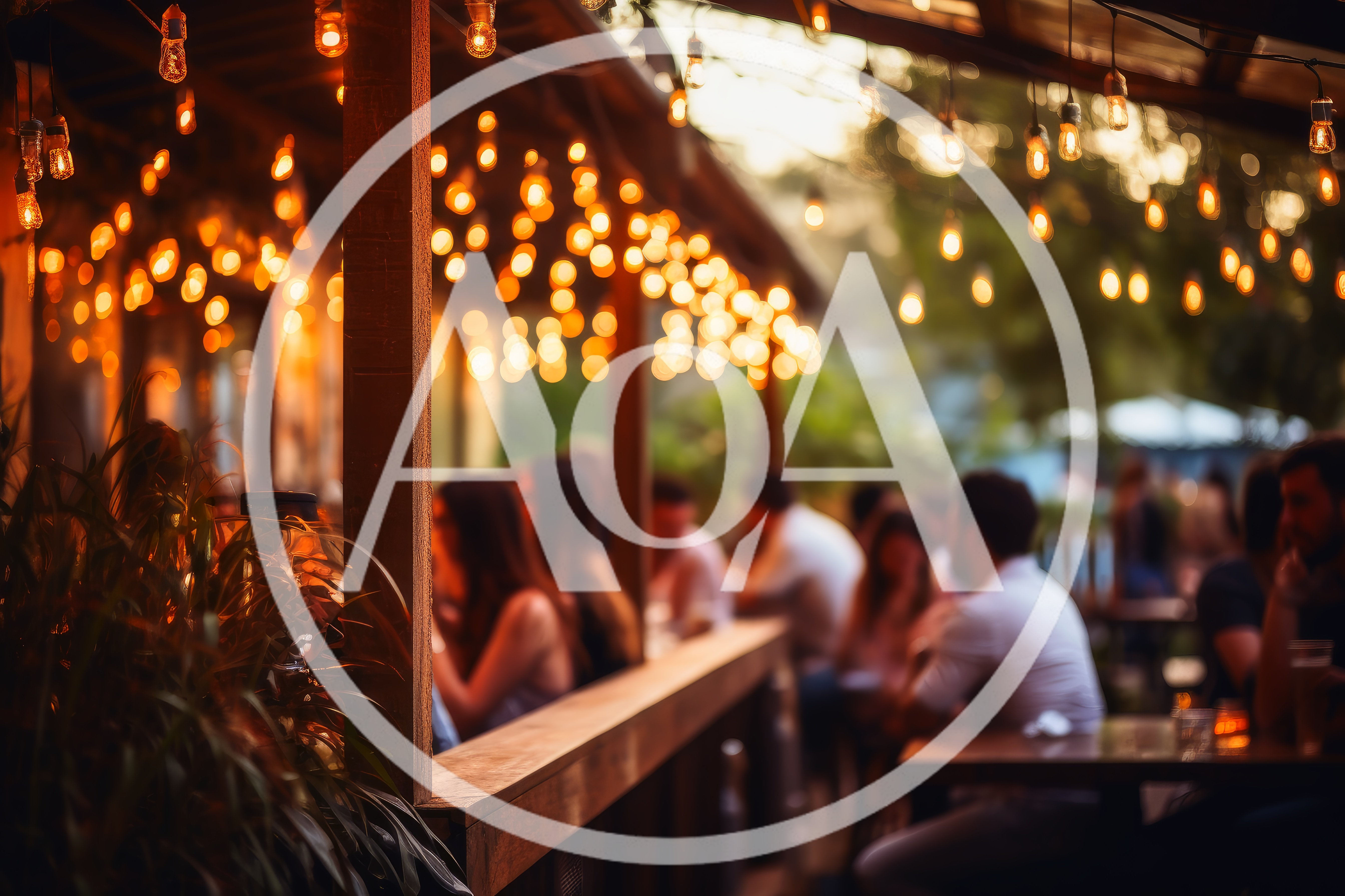 People Socializing at an Outdoor Restaurant Patio at Night