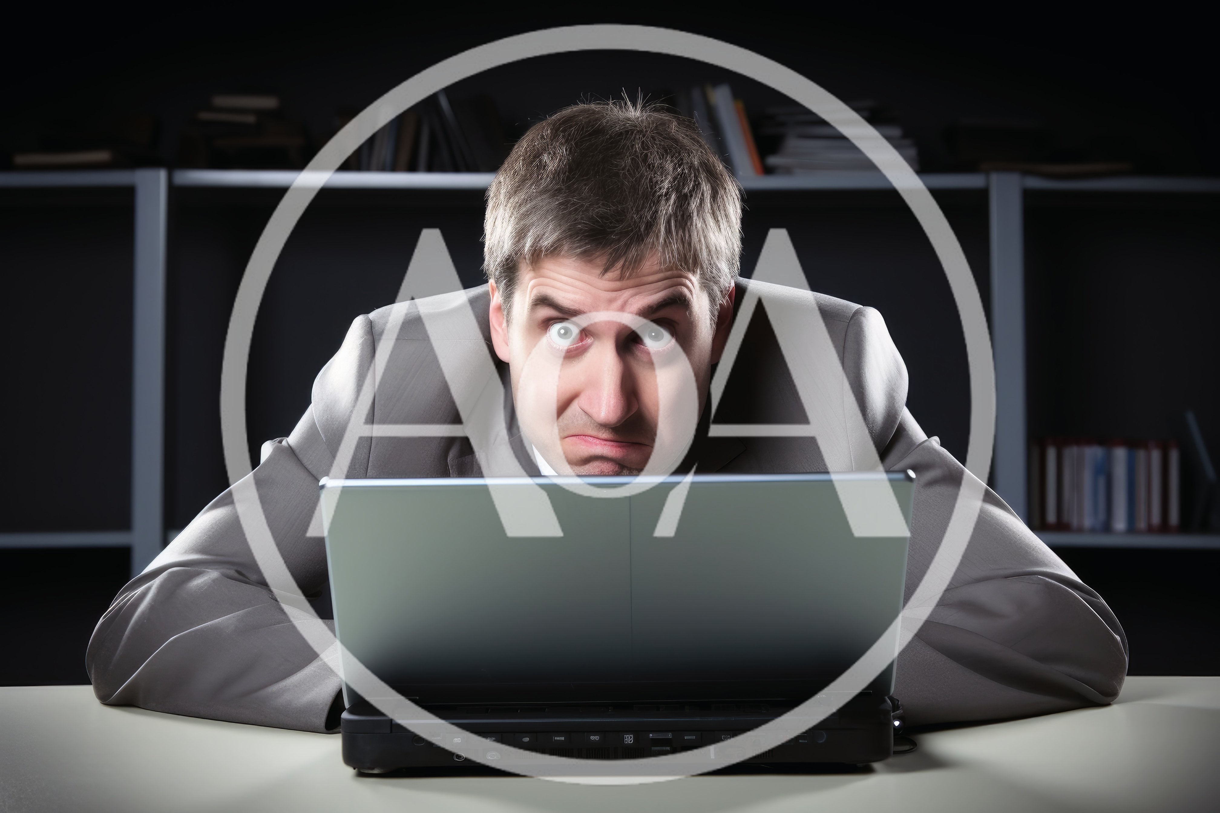 Stressed Businessman Looking At Laptop Screen In Office