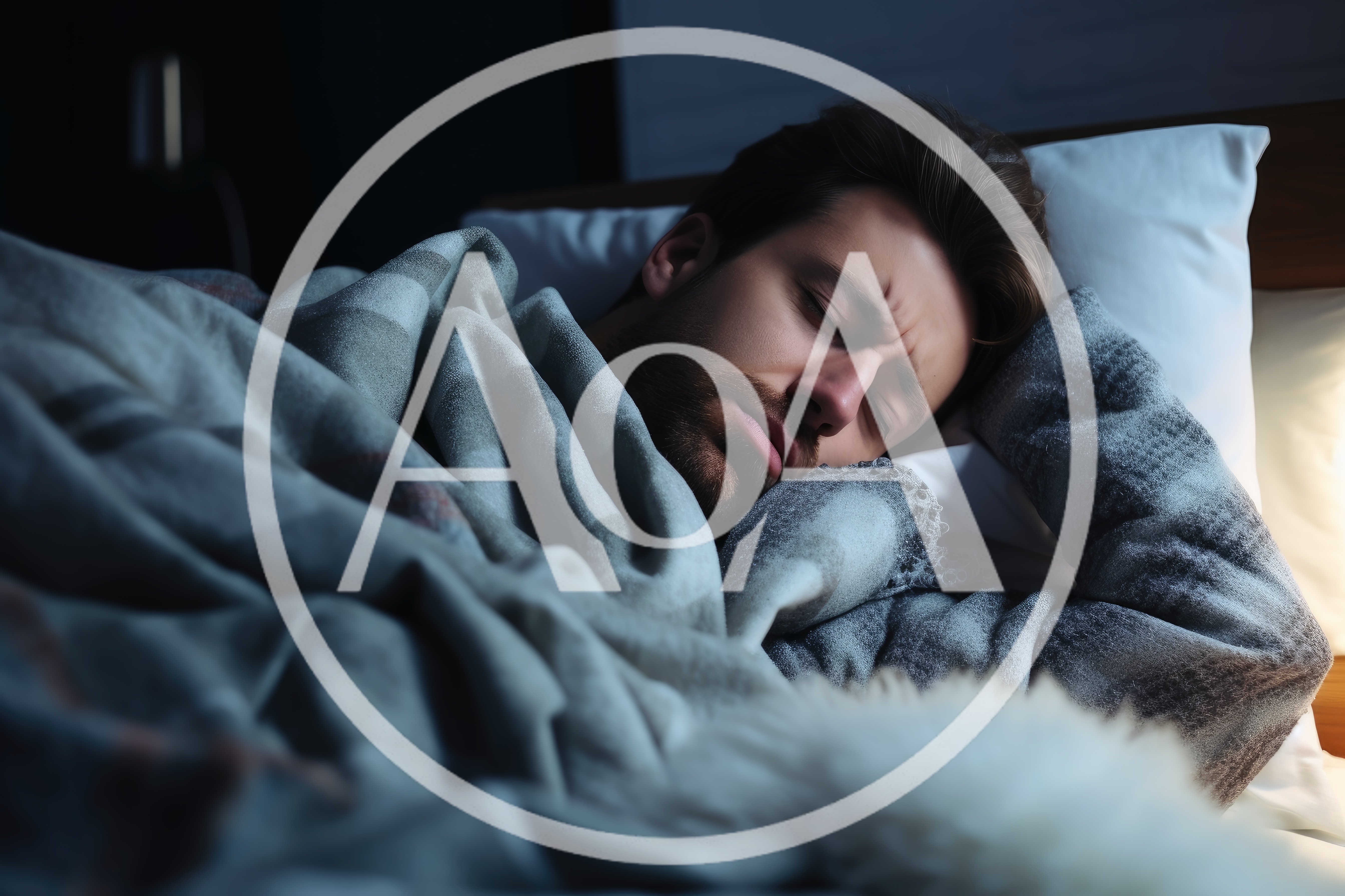Young Man Sleeping Restlessly In Bed At Night