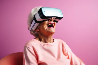 Elderly Woman Laughing While Wearing Virtual Reality Headset