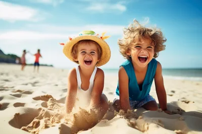 Two Happy Children Playing In The Sand On Beach