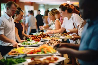 People Serving Themselves at a Buffet Line