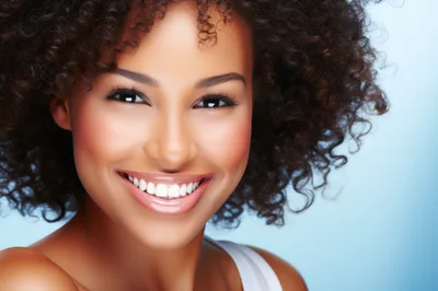 Portrait Of A Smiling Woman With Curly Hair