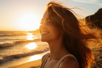 Happy Woman Enjoying Sunset On A Beach
