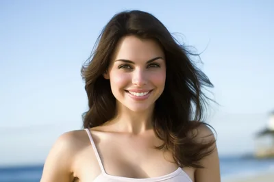Portrait Of A Smiling Young Woman Outdoors