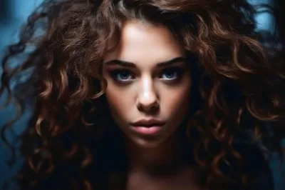 Portrait Of A Young Woman With Curly Hair
