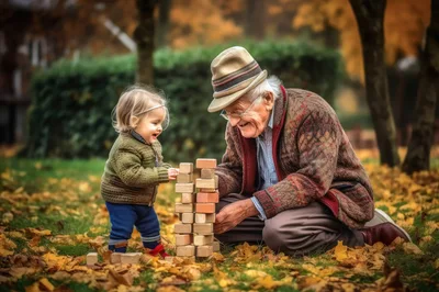 Grandfather and Toddler Playing with Wooden Blocks Outdoors