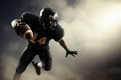 American Football Player Running With Ball