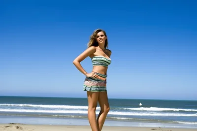 Young Woman Posing in Beachwear on Sunny Coastline